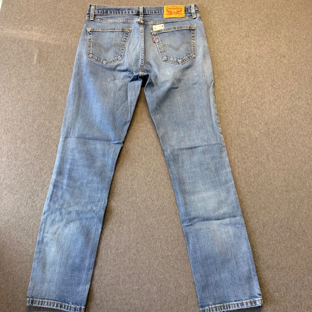 Levis 511 Slim Fit Jeans Mens 34x32 Light Wash Blue Denim Distressed 00511-1322